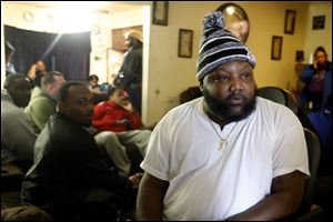 DeAngelo Gott discuses his son, DeShawn Gott, 21, as guests visit with the family at their home in West Toledo. DeShawn Gott was fatally shot Tuesday evening near the intersection of Woodland Avenue and City Park. His death marks the sixth homicide of 2018 in Toledo.