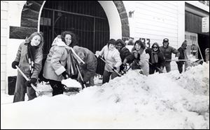 City of Toledo Recreation Division full and part-time employees create a snow cleaning crew to clear the sidewalks on downtown streets in January of 1978.