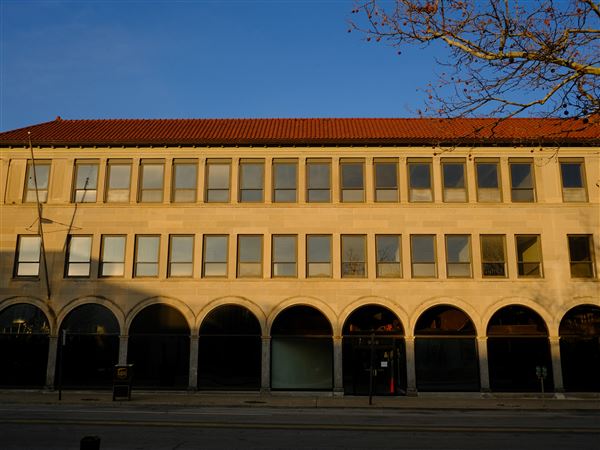 Law firm purchases downtown office building
