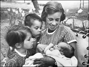 Elizabeth Bentley Rank, formerly Elizabeth Stranahan, with children Duane Stranahan lll, 4; Sarah, 3, and Page, 3 weeks.