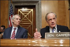 Senate Governmental Affairs Subcommittee Chairman Rob Portman (R., Ohio), left, listens to Ranking Member Thomas Carper (D., Del.), during a hearing on international mail and the opioid crisis.