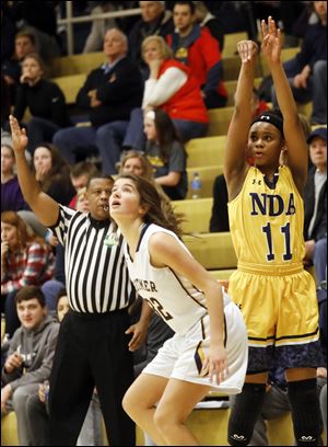Notre Dame's Kailah Johnson, right, shown in a game earlier this season, scored 21 points for the Eagles Thursday in a 68-29 win over Fremont Ross.