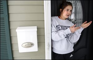 Joie Hoeflinger, next-door neighbor, speaks about her neighbor, Mark Alex Simon, on Stengel Avenue in Toledo on Friday, February 9, 2018. She interacted with him a few times, but was surprised to hear about his arrest. 