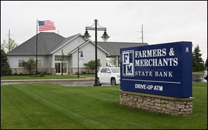 The Farmers & Merchants Bank at 7001 Lighthouse Way in Perrysburg is pictured Friday May 5, 2017.