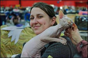 Mary Eve Normandin, of Quebec, with Fania, a 10-month-old sphinx.  