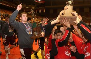 Genoa, left, won the Division III state dual title with a 40-20 victory over Massillon Tuslaw. Wauseon, right, took the Division II crown by beating Mentor Lake Catholic, 48-12.