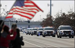 A police motorcade escorts the bodies of Westerville Police officers Anthony Morelli and Eric Joering.