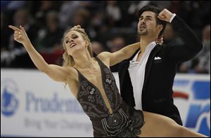 Madison Hubbell, left, and Zachary Donohue perform during the free dance event at the U.S. Figure Skating Championships in San Jose, Calif. Hubbell and Donohue still rely on Hubbell's mother to design and sew their costumes.