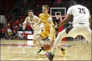 Toledo's Jaelan Sanford drives to the basket during a game at Ball State. Sanford is 7th in the MAC in scoring at 16.4 points per game.