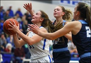Elmwood's Mattison Hillard, left, shown in a game earlier this season, scored 13 points for the Royals Wednesday in a sectional semifinal win over Woodmore.