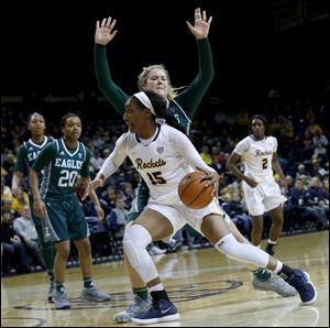 Toledo's Kaayla McIntyre goes to the basket around Eastern Michigan's Autumn Hudson during Wednesday's game at Savage Arena in Toledo.