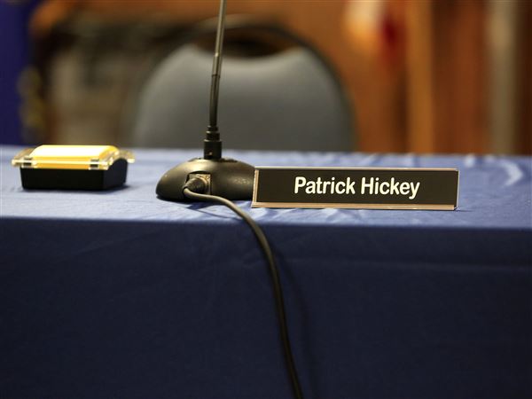 Hickey dominates school board meeting without being there