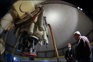 Ken Sembach, left, speaks with Noel Richardson, Ritter Observatory researcher, as they look over the telescope at the University of Toledo, Thursday, Feb.22, 2018. Ken Sembach, head of the Baltimore-based Space Telescope Science Institute that operates NASA's Hubble Telescope, was visiting with students before a speech Thursday night.  