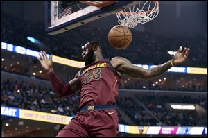 Cleveland Cavaliers forward LeBron James dunks during the first half of Friday's win over the Memphis Grizzlies.