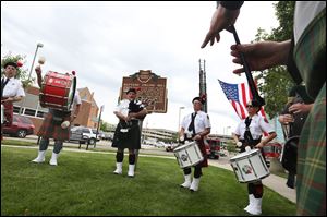 The Toledo Firefighters Pipes and Drums unit plays during the Toledo Fire and Rescue Department's 56th Annual Memorial Service to honor those who died in the line of duty last June.
