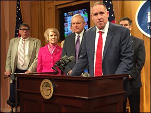 Rep. Bill Seitz (R., Cincinnati); Rep. Dorothy Pelanda (R., Marysville); Rep. Bill Reineke (R., Tiffin); Tiffin City Schools Superintendent Gary Barber;  (In rear) Rep. Craig Riedel (R., Defiance) held a press conference earlier this month in favor of a sweeping overhaul of Ohio’s educational structure.    THE BLADE/JIM PROVANCE