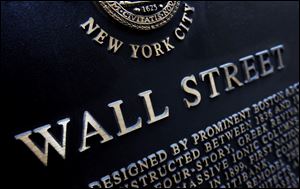 This Jan. 4, 2010, file photo shows an historic marker on Wall Street in New York. 
