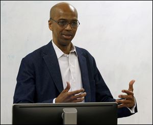 Howard University professor Rubin Patterson talks about his new book, 'Black Toledo,' during his speech at the University of Toledo Law Center.