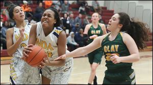 Notre Dame Academy's Ariel Cummings goes to the basket against Oregon Clay's Samantha Stanley during a Division I district semifinal at Genoa High School Thursday, March 1, 2018.