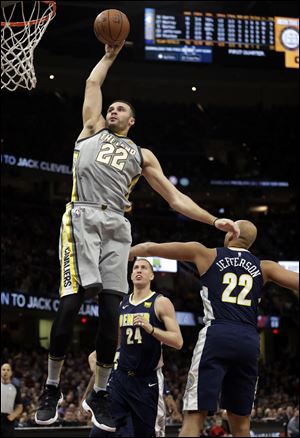 Cleveland Cavaliers' Larry Nance Jr. dunks the ball against the Denver Nuggets.