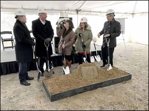 Brian McMahon, left, Brent Gerken, and Lucas County Commissioners Tina Skeldon Wozniak, Carol Contrada, and Pete Gerken broke ground on a 100,000-square-foot spec building near Toledo Express Airport in December.