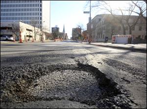 A pothole on Erie Street in downtown Toledo.
