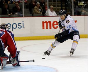Toledo Walleye forward Tyler Sikura closes in on Kalamazoo Wings goalie Joel Martin during a game in November, 2016. Sikura signed a one-year deal with the Chicago Blackhawks today.