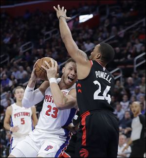 Detroit Pistons forward Blake Griffin  looks to shoot as Toronto Raptors forward Norman Powell defends.