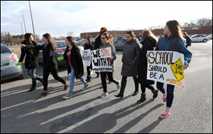 Students walkout of Northview High School in Sylvania Wednesday, March 14, 2018, to show support for the 17 high school students shot and killed in Parkland, Florida last month.  