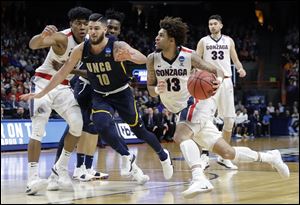 Gonzaga guard Josh Perkins drives against UNC-Greensboro during the teams' first-round game. Perkins had 20 points in the Bulldogs' first game vs. Ohio State this year.
