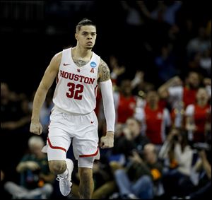 Houston guard Rob Gray celebrates after making the game-winning basket in a first round NCAA Tournament game against San Diego State.