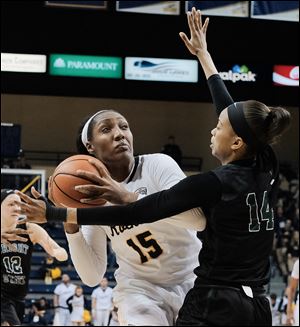 Toledo's Kaayla McIntyre prepares to shoot over Wright State forward Nia Sumpter during a WNIT first round game Friday at Savage Arena in Toledo. 