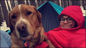 Alexis Waclawski and her dog, Moose, pose together earlier this year. Waclawski posted a video of Moose snoring that's garnered more than 4.5 million views on Twitter.