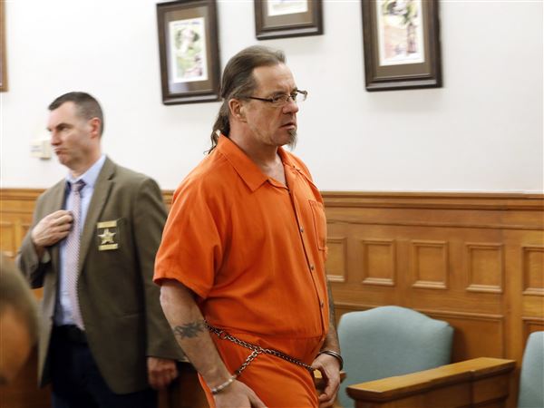 Ex-Marine gets 8 years in prison; curses in court