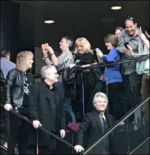 Fans take pictures as Bon Jovi and The Moody Blues arrive Friday at the Rock and Roll Hall of Fame in Cleveland.