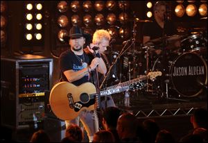 Jason Aldean performs live on Thursday in Burbank, Calif. Aldean was performing in Las Vegas earlier this year during the shooting that claimed 58 lives. During this weekend's Academy of Country Music awards, Aldean will participate in a tribute to those affected by the tragedy.