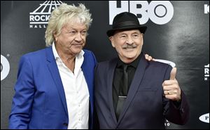 John Lodge, left, and Mike Pinder, both members of the Moody Blues, arrive on the red carpet before the Rock and Roll Hall of Fame induction ceremony.