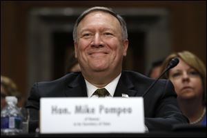 Secretary of State-designate Mike Pompeo smiles after his introduction before the Senate Foreign Relations Committee during a recent confirmation hearing.