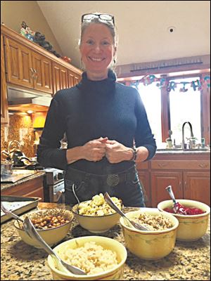 Aimee Strohbeck serves Buddha Bowl featuring several vegetables.