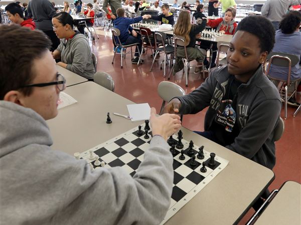 Toledo school’s chess club is a refuge for young minds