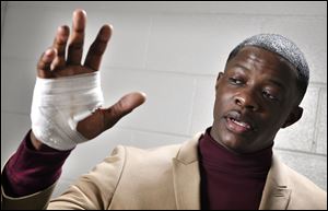 James Shaw Jr., shows his hand that was injured when he disarmed a shooter inside a Waffle House on Sunday in Nashville, Tenn.
