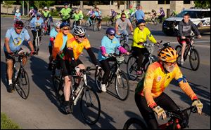 Bicyclists ride on Bancroft Street during Toledo's Ride of Silence in 2016.