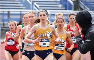 UT runner Janelle Noe leads the pack during the 1500-meter race at the MAC championships with teammate Petronela Simiuc right behind.