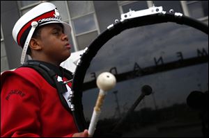 A Rogers High School band member performs during the Memorial Day Parade.