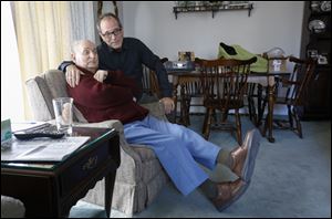 Matt Lentz and his 92-year-old father Phillip Lentz, watche television at the elder Lentz's home.