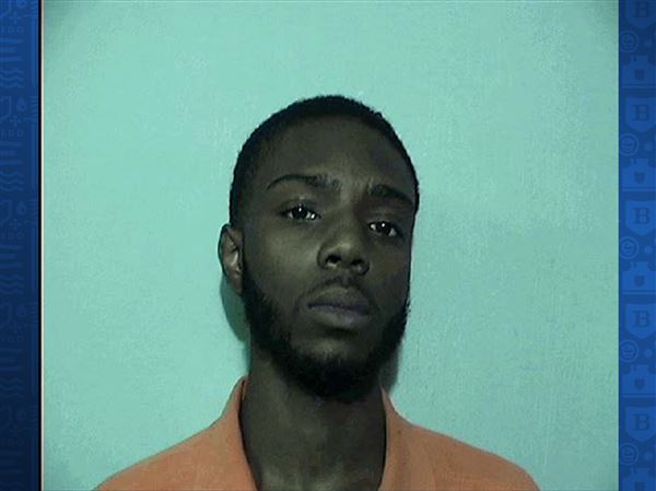 Toledo man accused of shooting another with a stolen gun