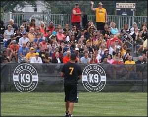 Fans wave and take pictures as Ben Roethlisberger takes the field.