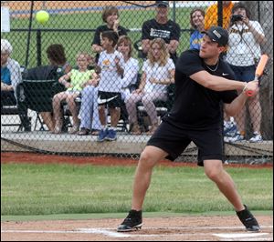 T.J. Watt of the Pittsburgh Steelers gets ready to hit the ball during a charity softball game at the Findlay High School.