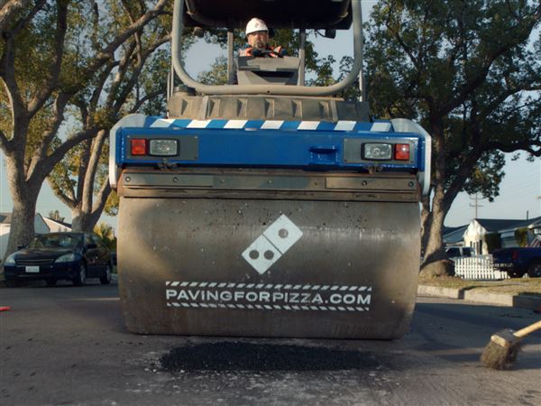 Domino's fills stomachs, sets sights on filling potholes