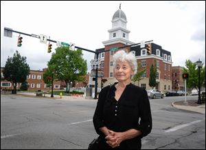 Jackie Fletcher in front of the new Seneca County Justice Center in Tiffin.
